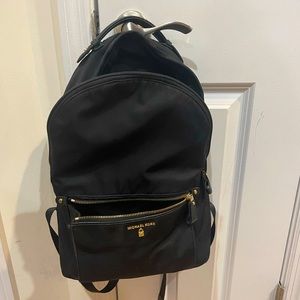 Michael Kors backpack with gold zippers